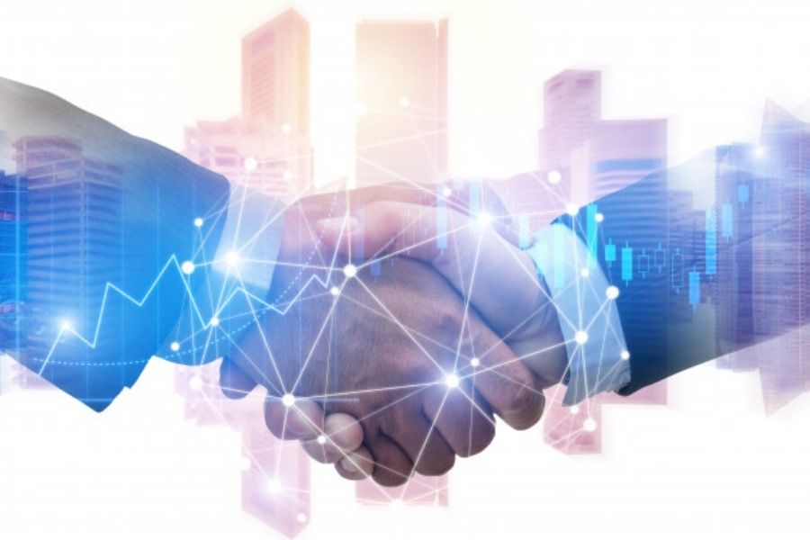 Businessmen shaking hands confirming business alliance